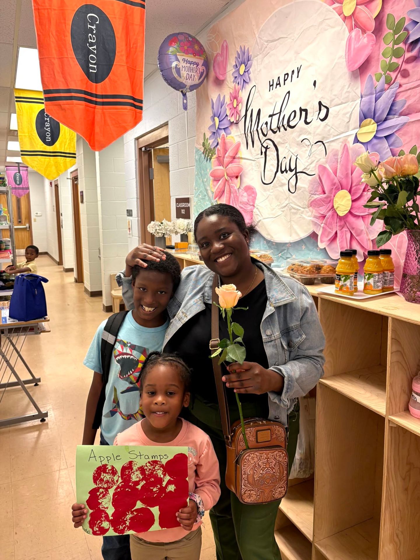 Mother and two children celebrating Mother's Day at the Learning Center